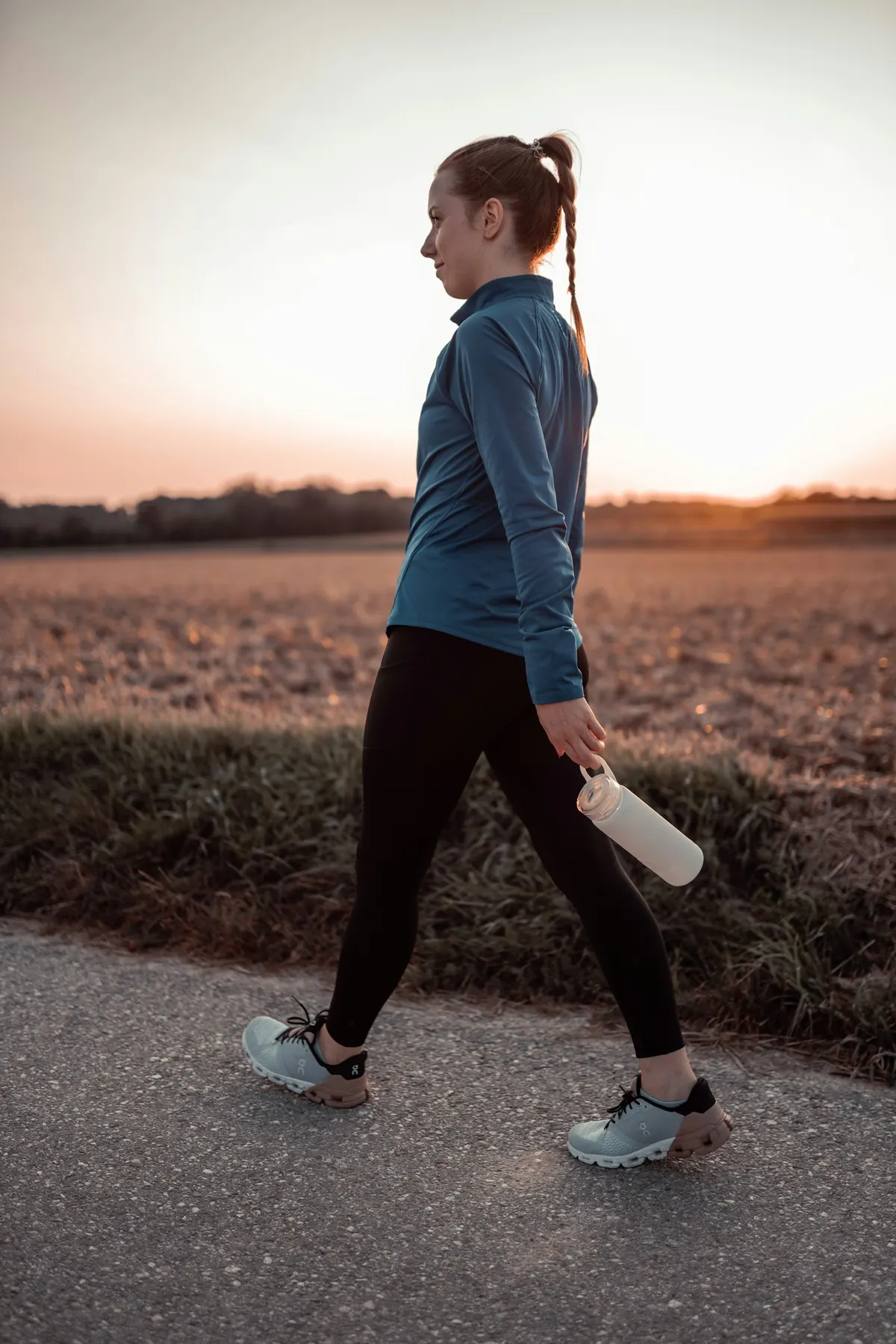 Woman walking outdoors in morning light